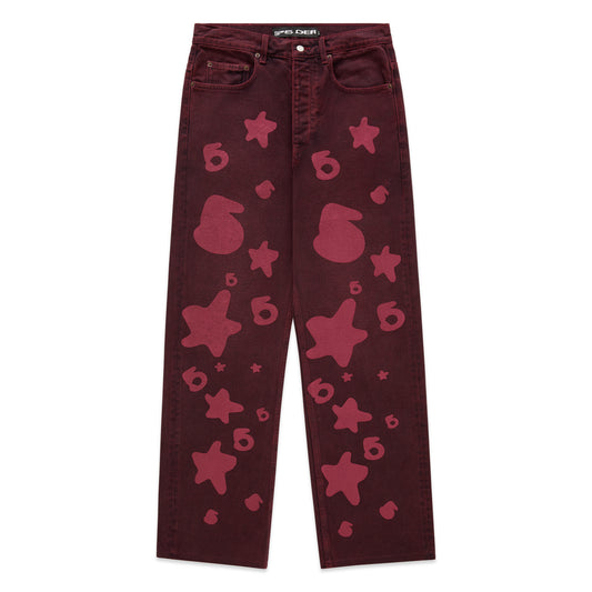 Faded wash Beluga Denim pants with red star and "6" print, custom hardware, and straight leg fit.