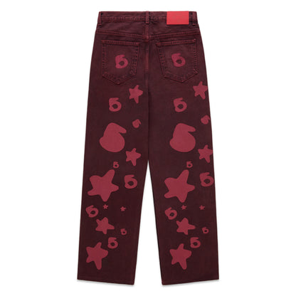 Faded wash Beluga Denim pants with red print, custom hardware, and leather back patch.