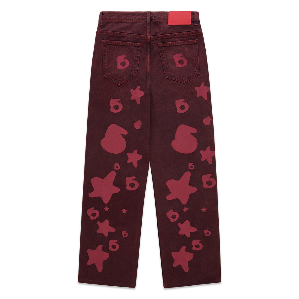 Faded wash Beluga Denim pants with red print, custom hardware, and leather back patch.