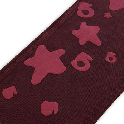 BELUGA DENIM faded wash jeans with red Beluga print stars and numbers.