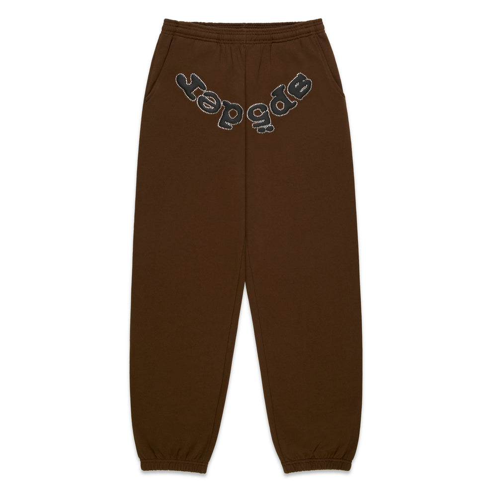 Brown cotton fleece sweatpants with "SP5DER" rhinestone logo on the crotch.