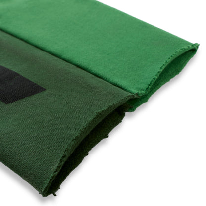 SUPERFIVE SWEATPANT: Two-tone green 13oz cotton fleece with raw hem and black graphic print.