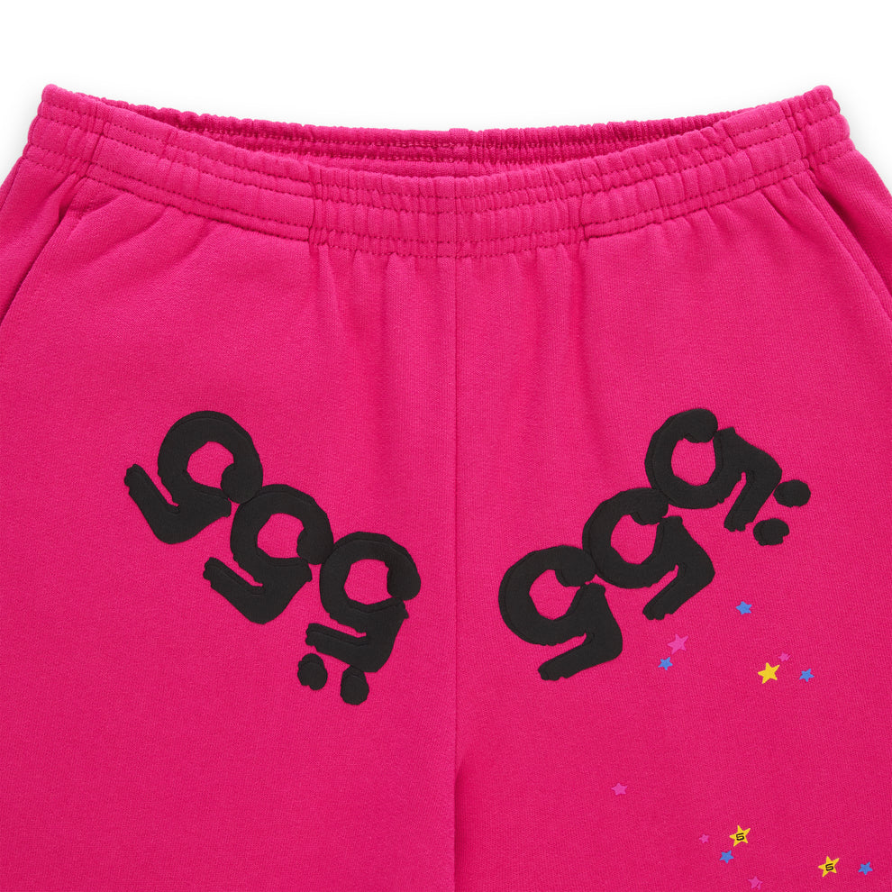 Pink fleece sweatpants with black puff print '555' angel numbers and scattered star print.