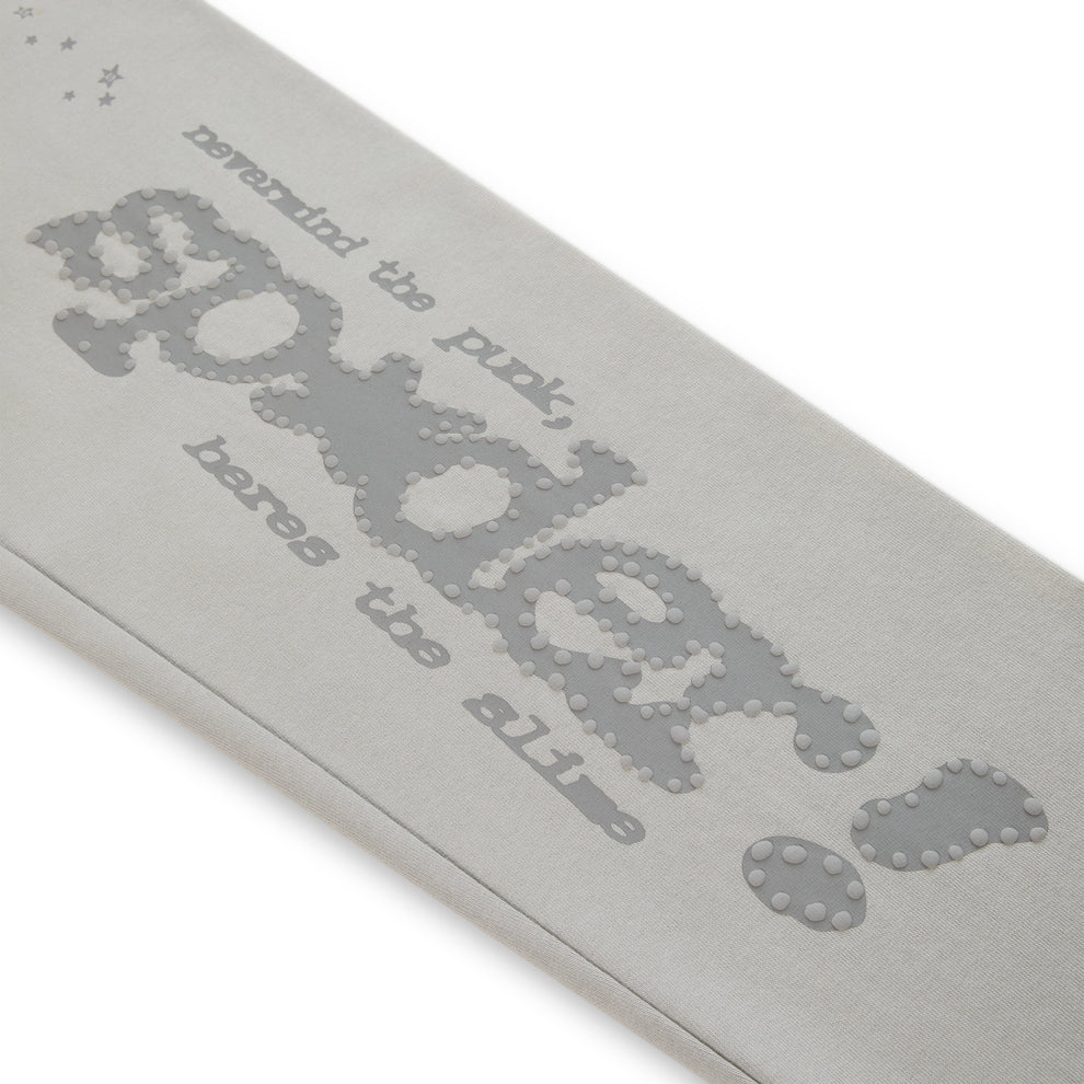 Light gray cotton fleece sweatpant with "Sp5der" puff print and "nevermind the punk, heres the slime" text.