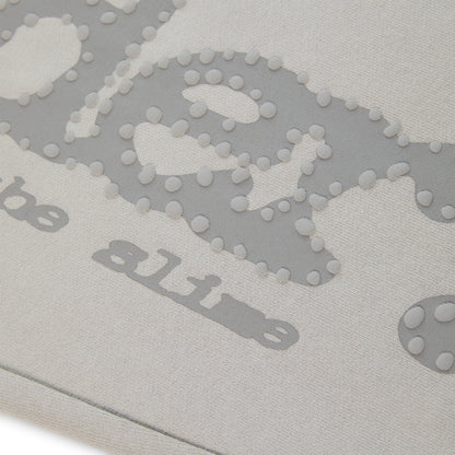 Light grey cotton fleece sweatpants with puff print "P*NK SP5DER" text and scattered stars.