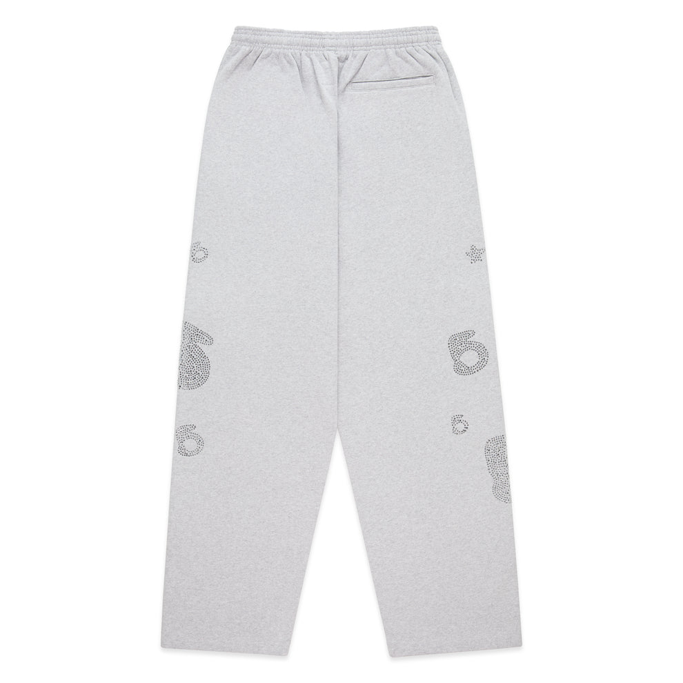 Light grey wide-leg sweatpants with rhinestone '5' and star designs, elastic waistband.