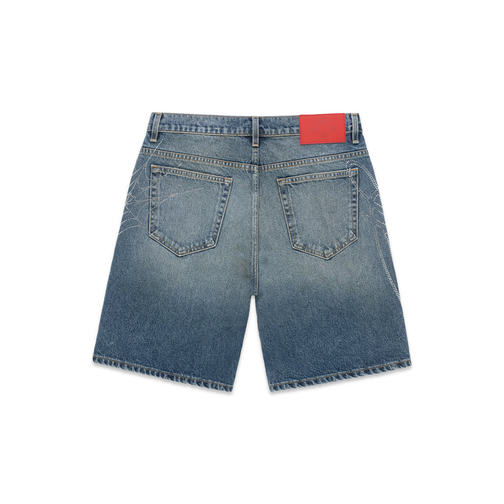 Washed blue denim shorts with rhinestone web design on sides and red back patch.