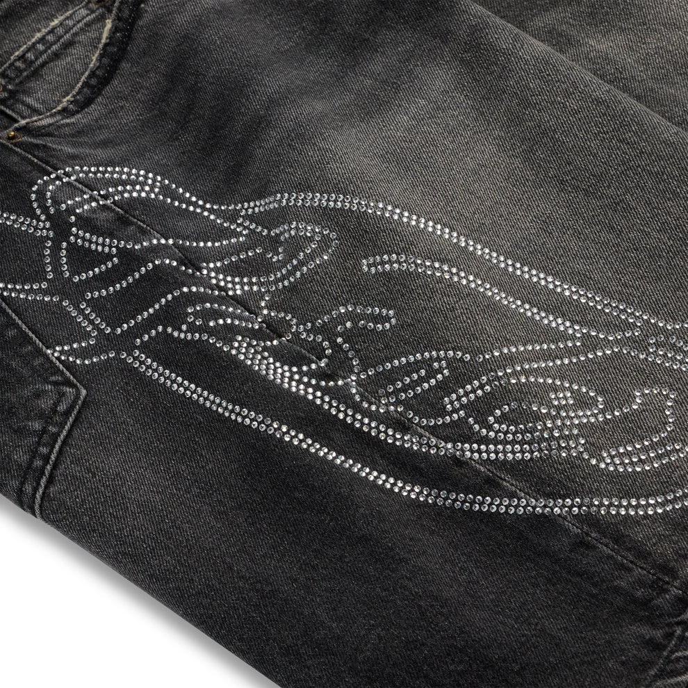 Vintage wash black denim shorts with a large rhinestone web and text design.