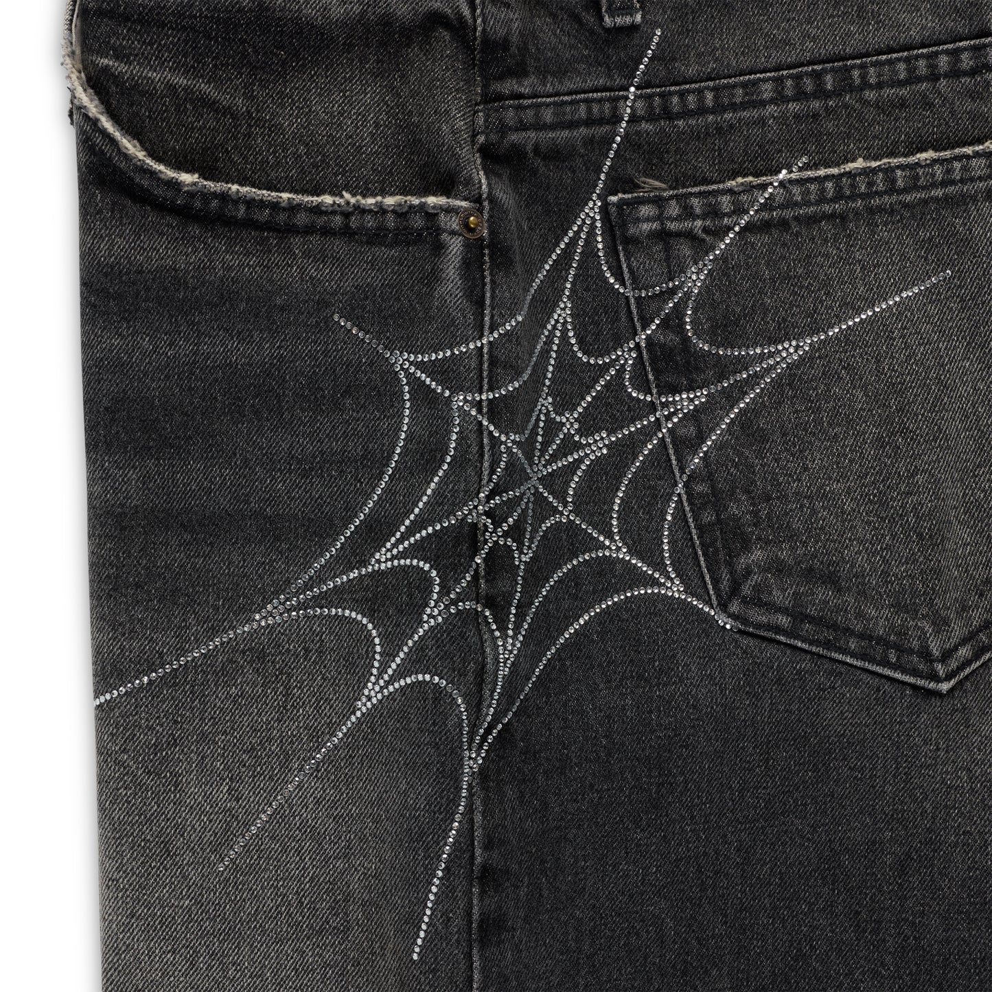Vintage wash black denim shorts with a sparkling rhinestone spider web design on the back pocket.