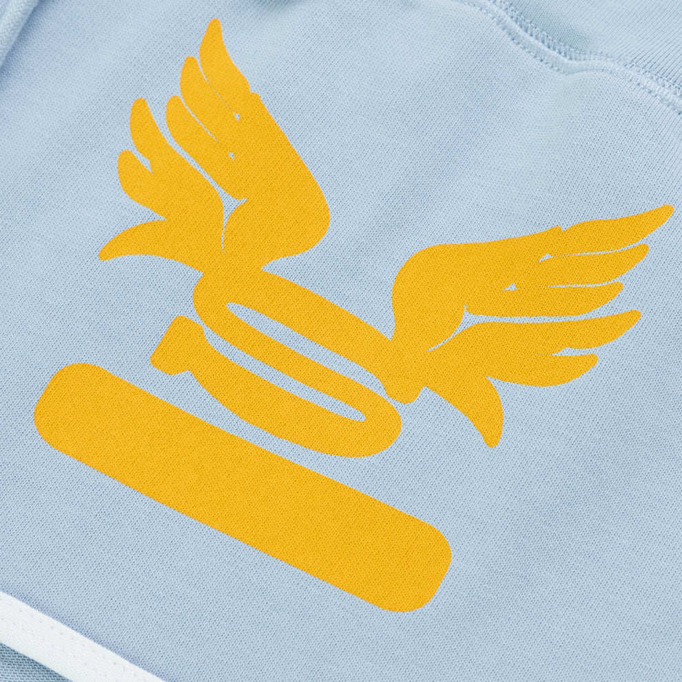 Light blue SP5 WIDE BOXER with a large yellow winged logo and bar graphic.