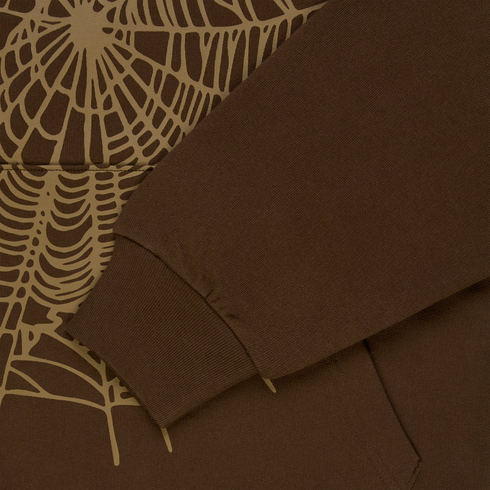 Brown cotton fleece hoodie with tan rhinestone spider web and text detail.