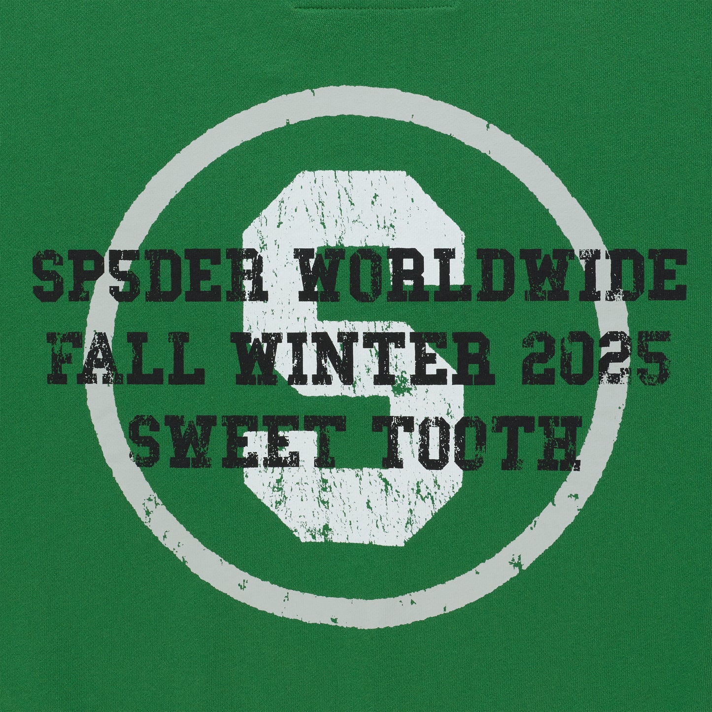 Green crewneck with distressed white "S" logo and "SP5DER WORLDWIDE FALL WINTER 2025 SWEET TOOTH" text.