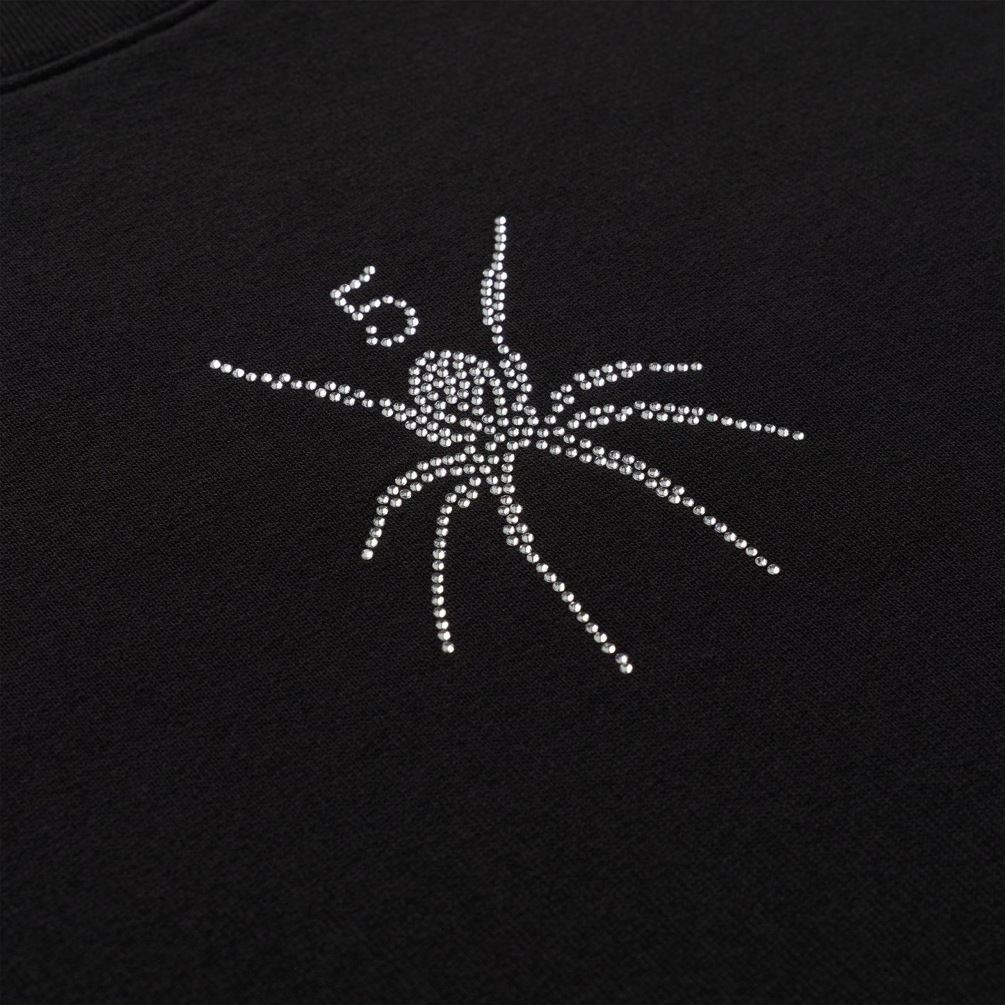 Black cotton crewneck with rhinestone spider graphic and "5" detail.