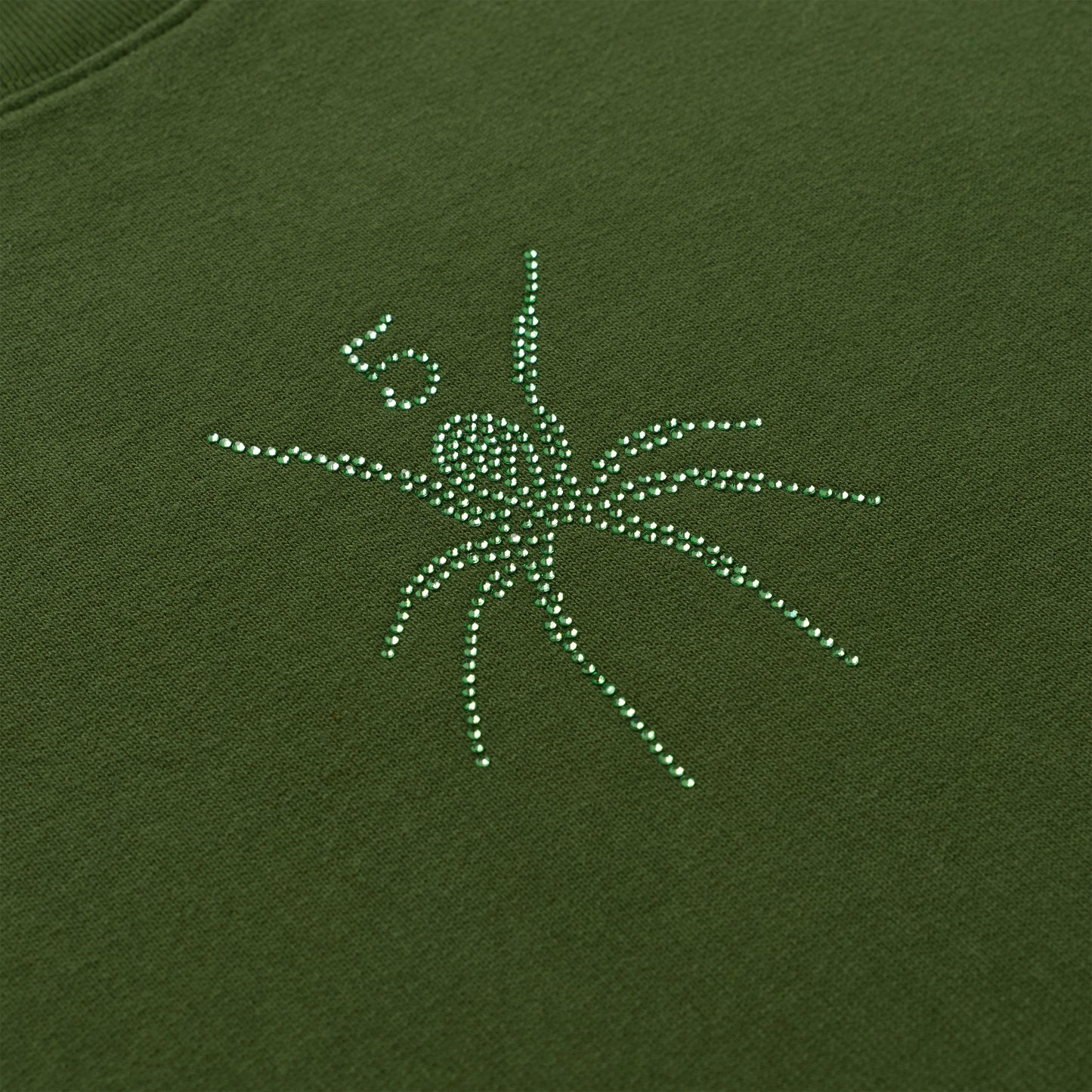 Olive green cotton crewneck with a sparkling green rhinestone spider graphic.