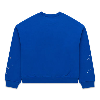 Blue crewneck sweatshirt with ribbed cuffs and hem, featuring subtle white speckled details on sleeves.