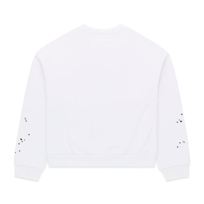 White 13oz cotton brushed fleece crewneck with scattered black star print on sleeves.