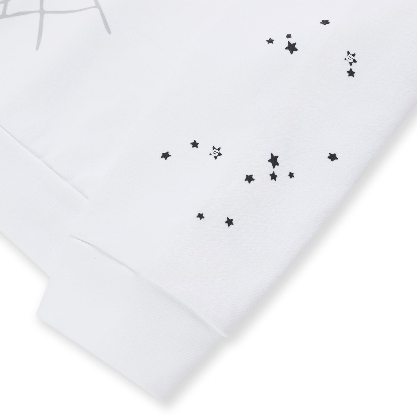 White 100% cotton fleece crewneck with scattered black star print and ribbed cuff.