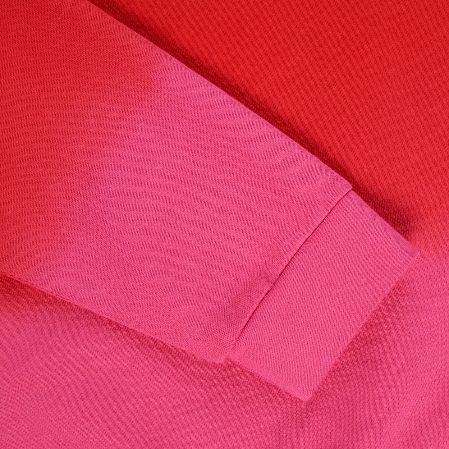 Red and pink gradient crewneck sleeve with ribbed cuff, 100% cotton brushed fleece.