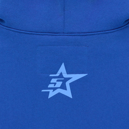 Close-up of a blue hoodie with a light blue star and "SG" logo on the back.