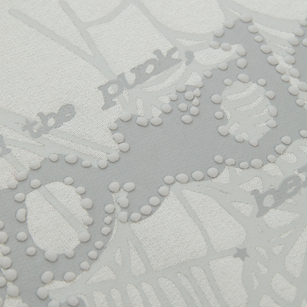 Close-up of a white cotton fleece hoodie with gray puff print "Punk" text and spider web design.