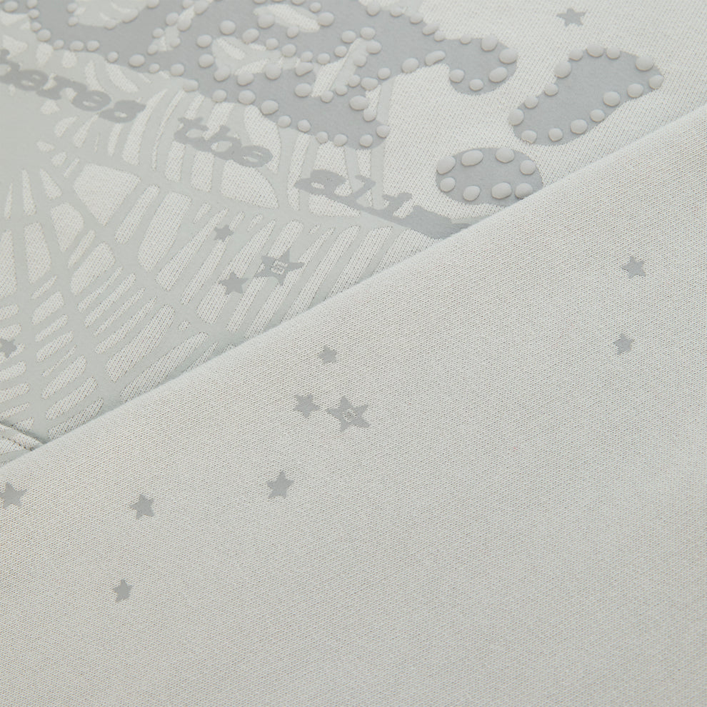 Light grey cotton fleece hoodie with puff print P*NK SP5DER motif, web, and scattered star design.