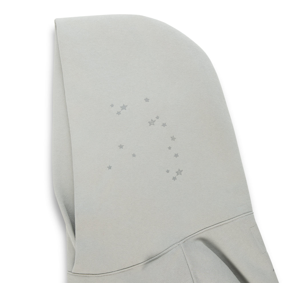 Light gray cotton fleece hoodie with subtle scattered star print on the hood.