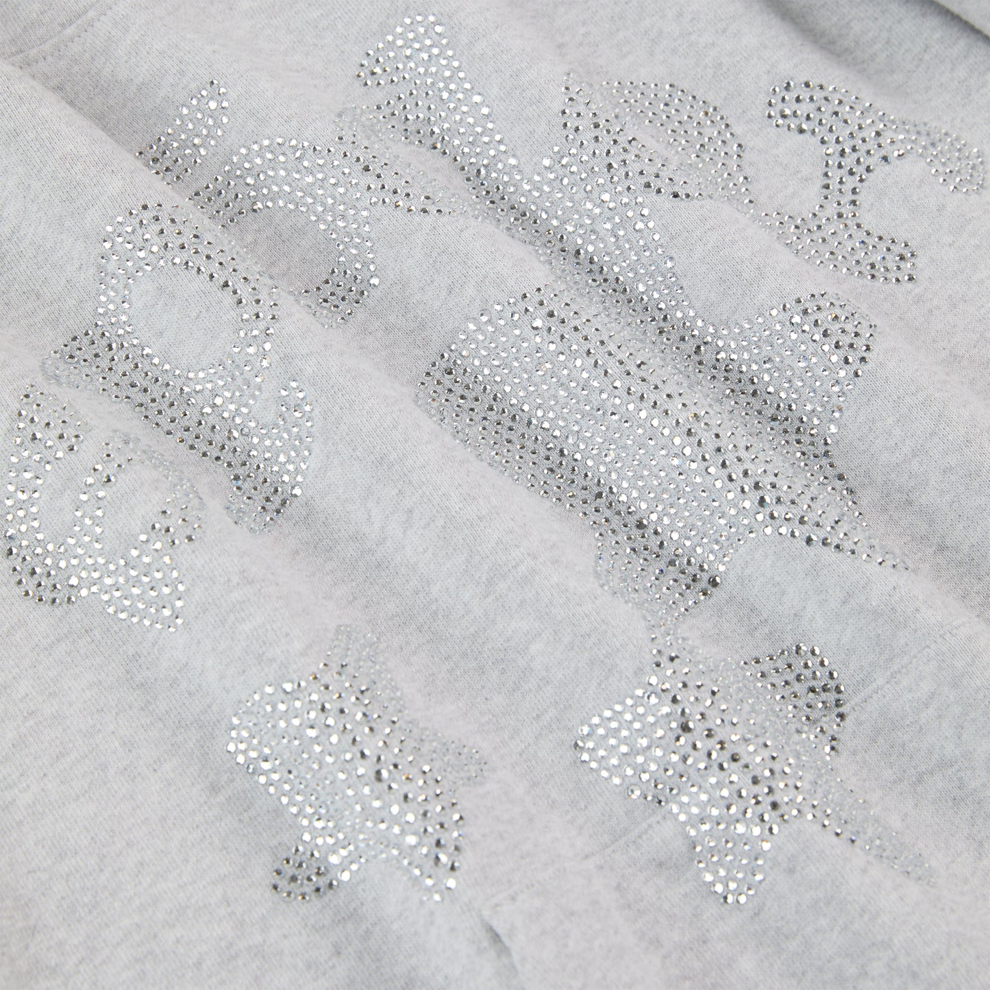 Gray 100% cotton fleece hoodie with rhinestone "SP5DER" text and star embellishments.