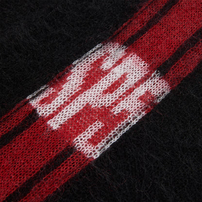 Black mohair knit sweater with red and white vertical stripes and "SP5" logo.