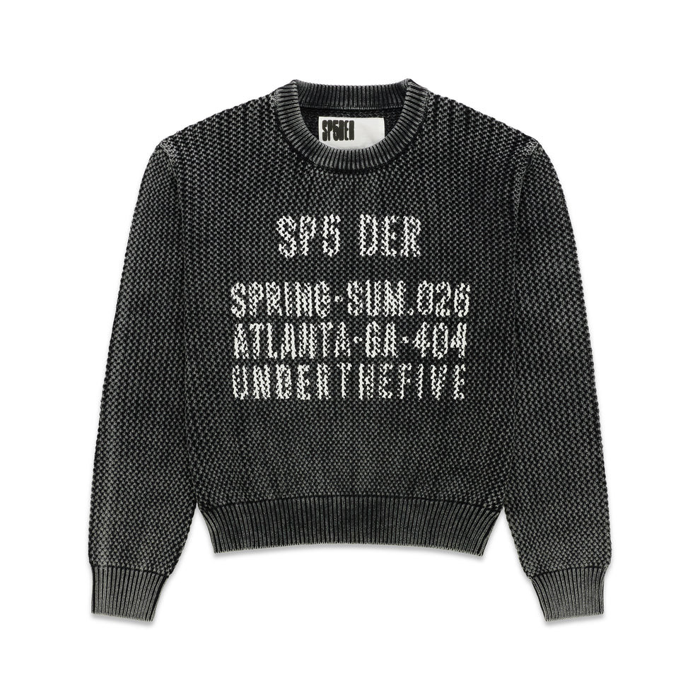 Black knit cotton UNDERTHEFIVE sweater with white text print at chest, ribbed crewneck, hem, and cuffs.