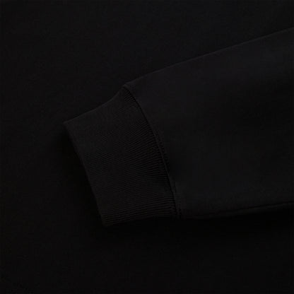 Close-up of a black 555 SP5DER long sleeve's ribbed cuff and sleeve, 100% cotton.