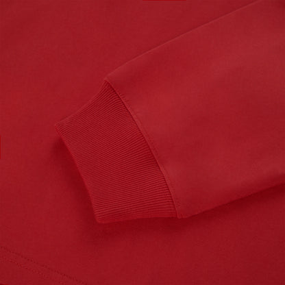 Close-up of a vibrant red 555 SP5DER long sleeve tee with ribbed cuffs.