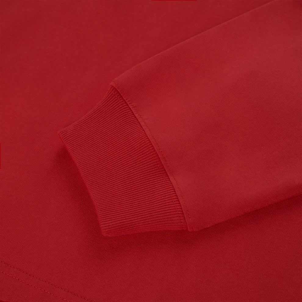 Close-up of a vibrant red 555 SP5DER long sleeve tee with ribbed cuffs.