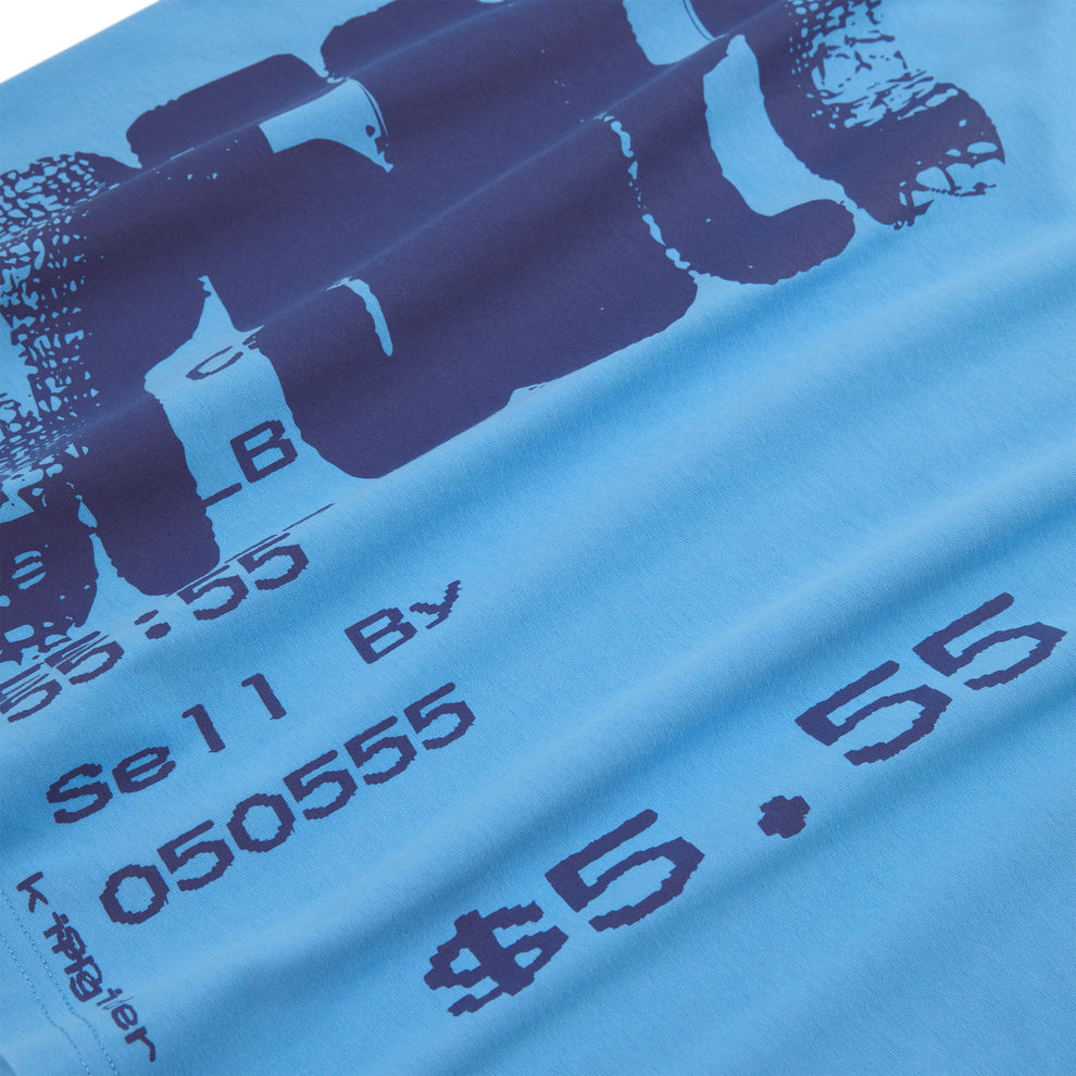 Light blue 100% cotton tee with dark blue graphic print featuring numbers and text.