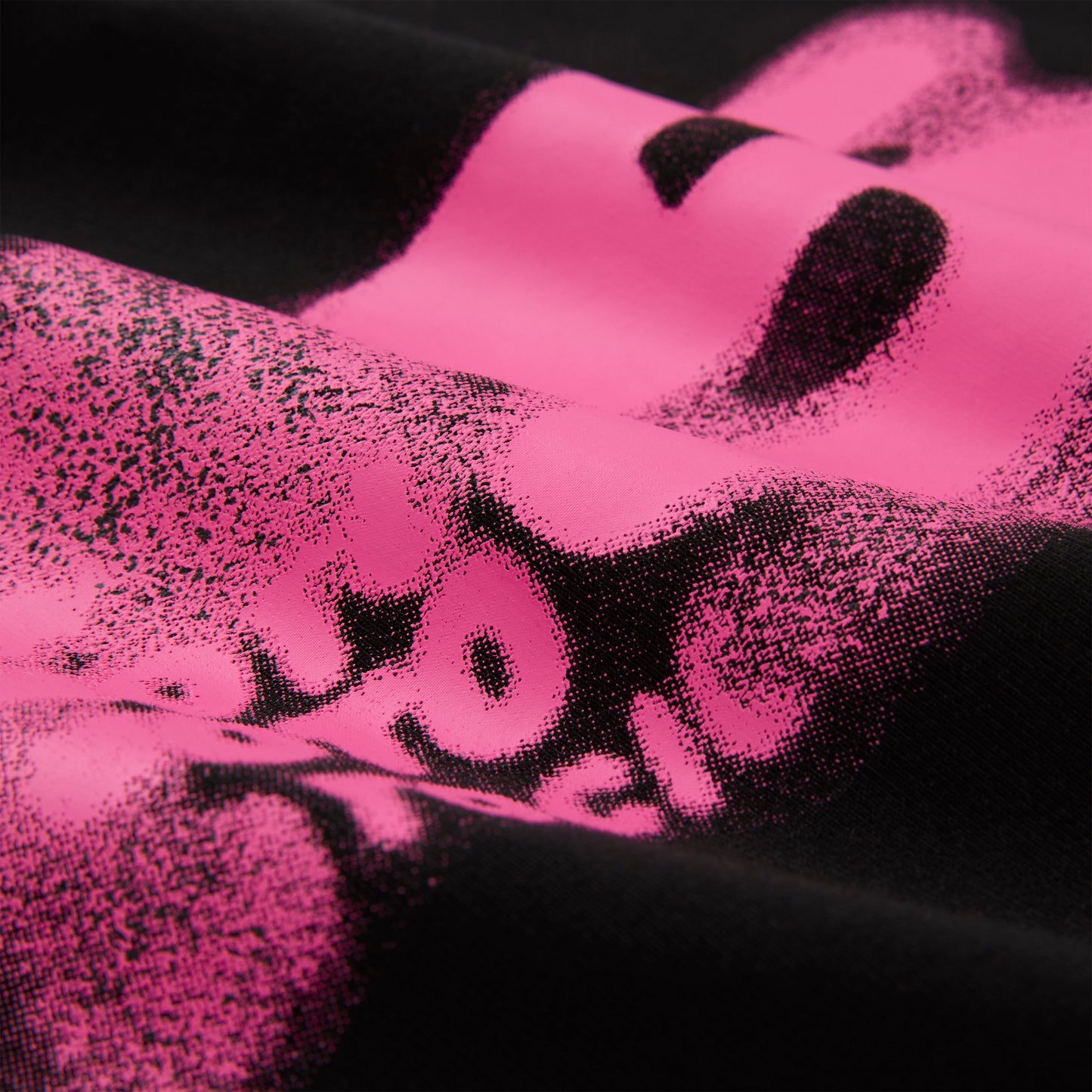 Black cotton/spandex cropped baby tee with a vibrant pink distressed graphic print.