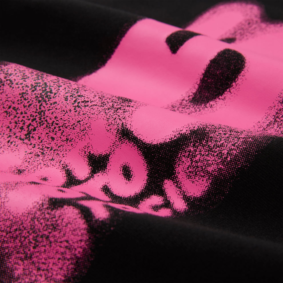 Black cotton/spandex cropped baby tee with a vibrant pink distressed graphic print.