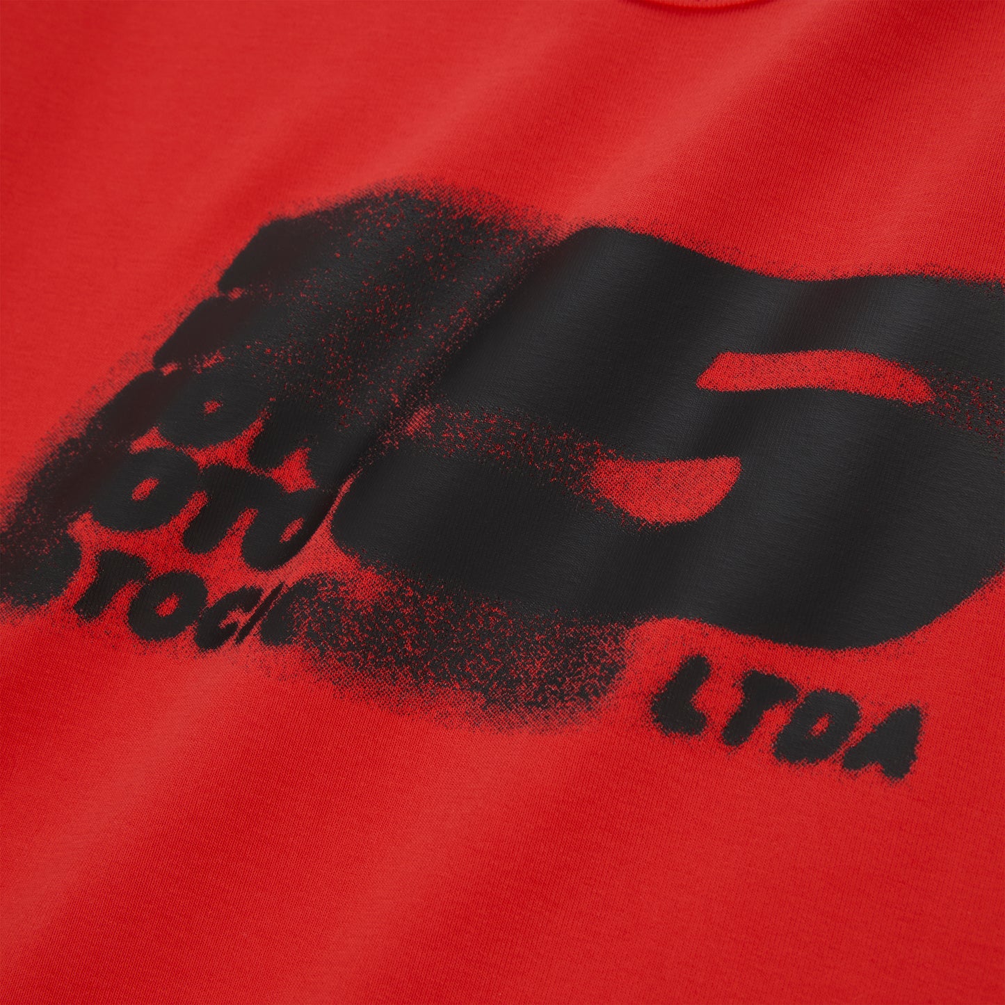 Red cotton/spandex cropped baby tee with a black distressed "MOTO 5" graphic print.