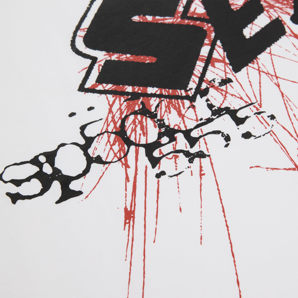 White cotton VIVIENNE TEE with black and red graphic print, featuring a distressed, splattered design.