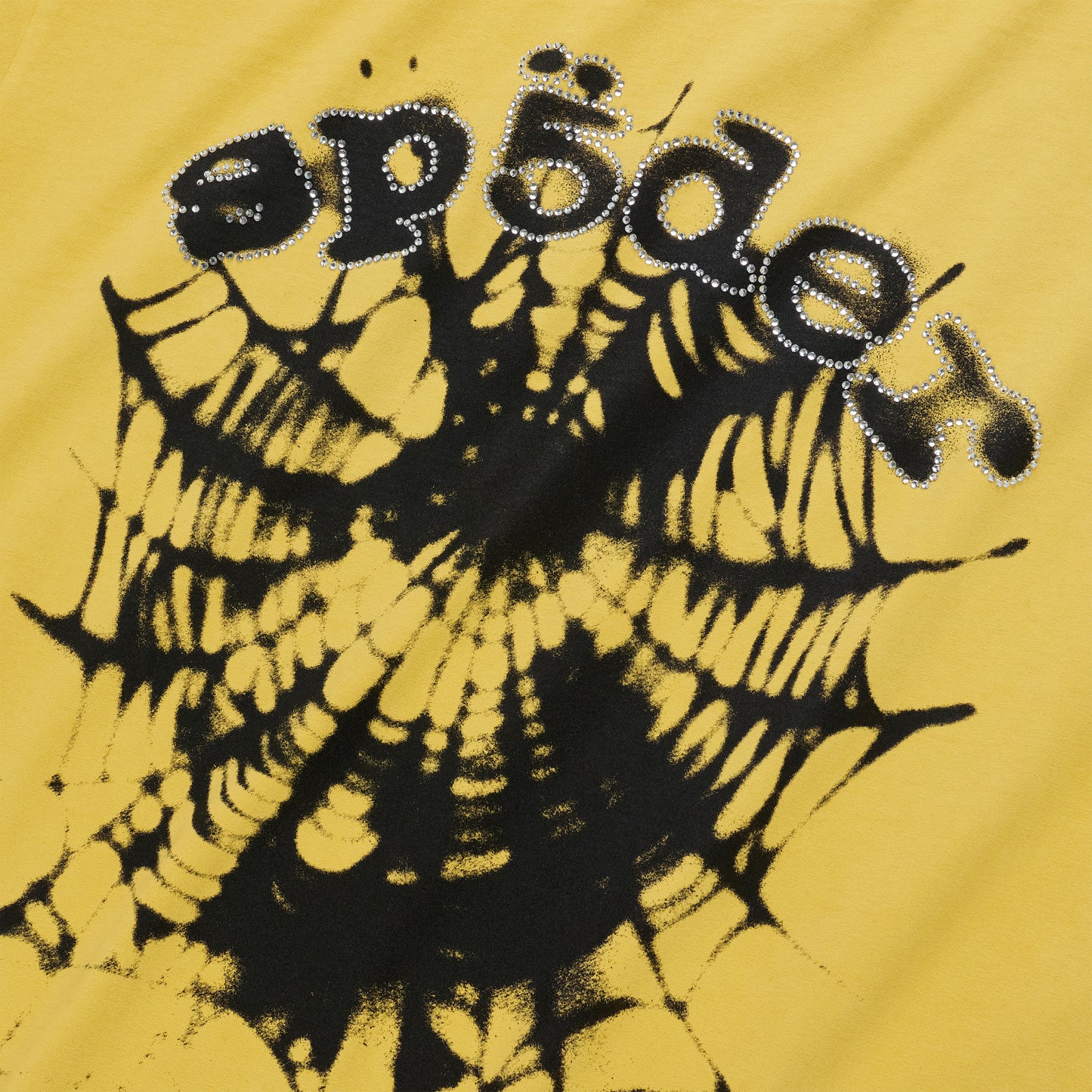 OG WEB V2 TEE: Yellow cotton tee with black spiderweb graphic and "sp5der" text in rhinestones.