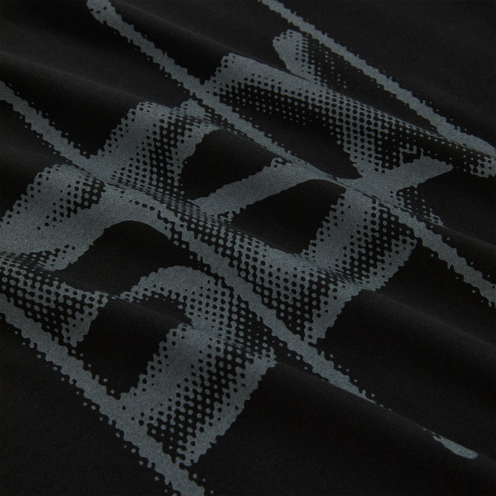 Black cotton long sleeve tee with a grey halftone graphic print.