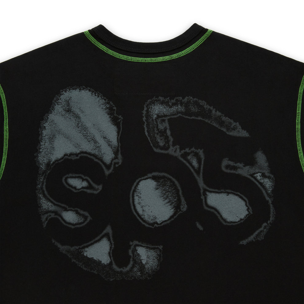 Black cotton long sleeve tee with green contrast stitching and a faded grey graphic print.