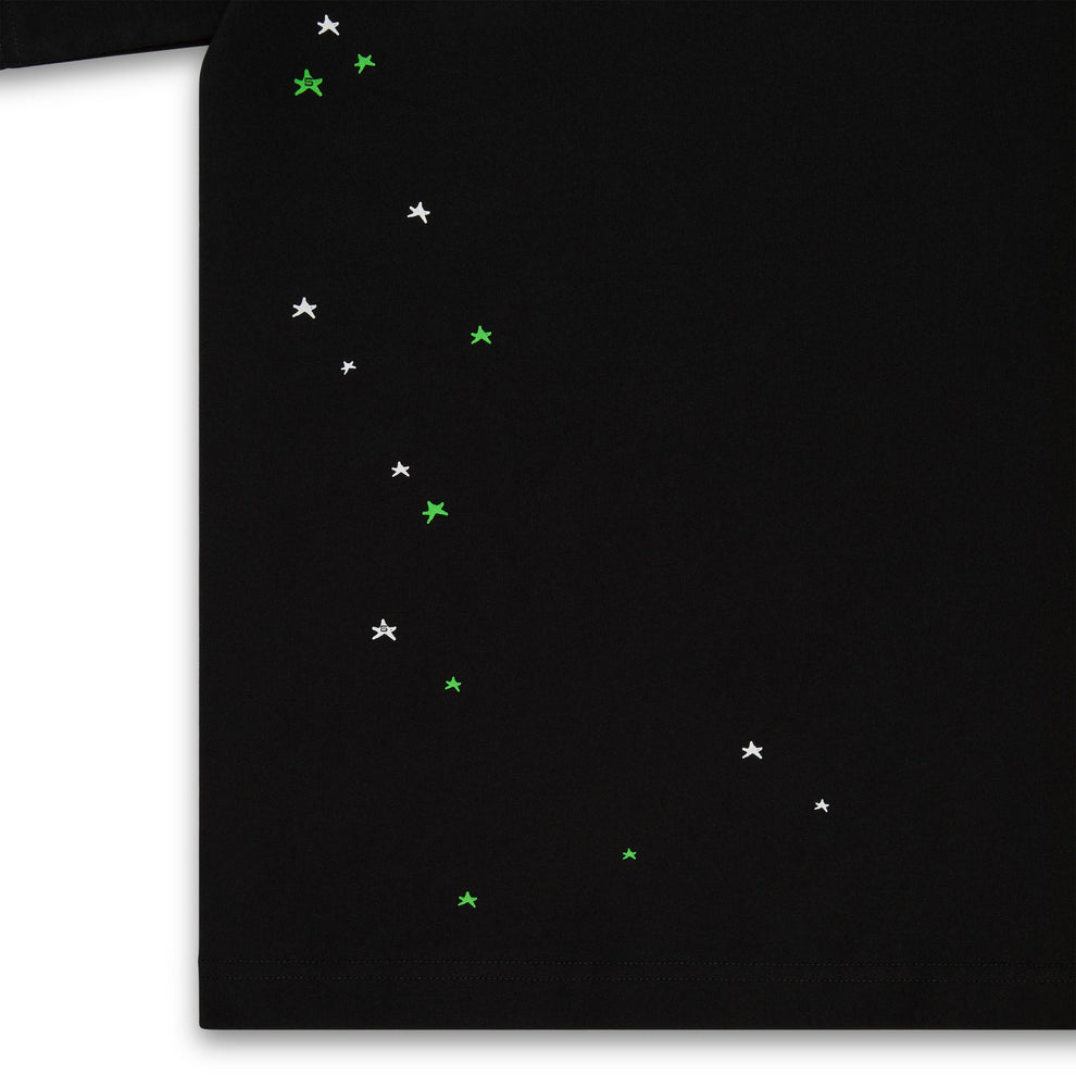 Black 100% cotton lightweight tee with scattered white and green star print.