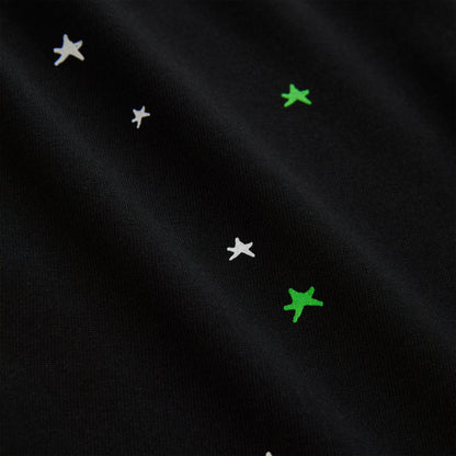 Black 100% cotton lightweight tee with white and green star print.