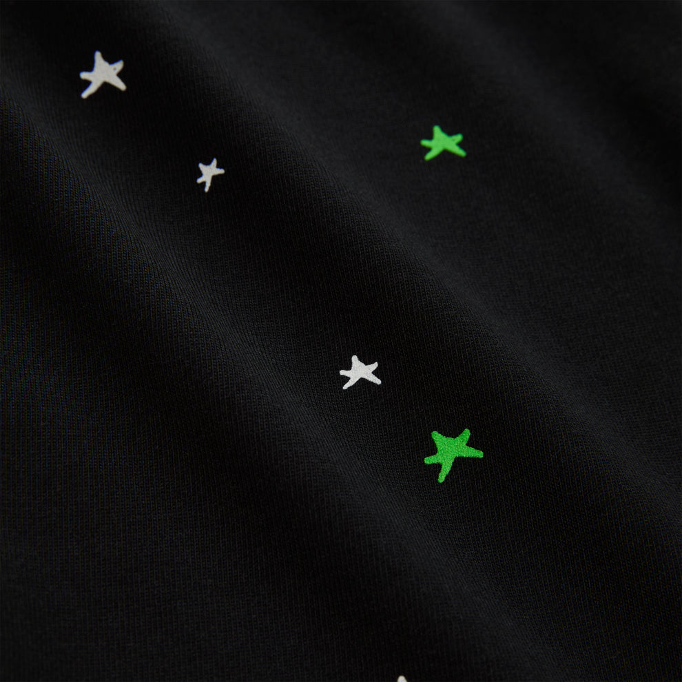Black 100% cotton lightweight tee with white and green star print.