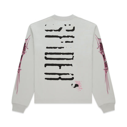 Light grey 100% cotton long sleeve tee with black graphic print on back and pink web design on sleeves.
