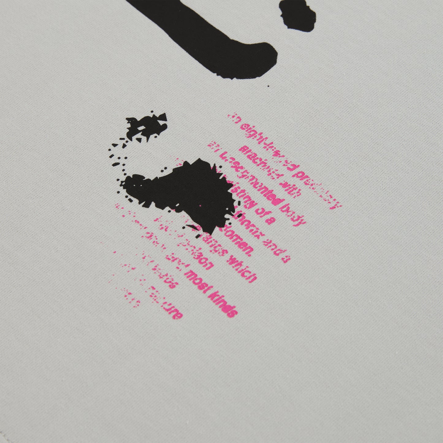 White cotton long sleeve tee with black and pink graphic print detail.