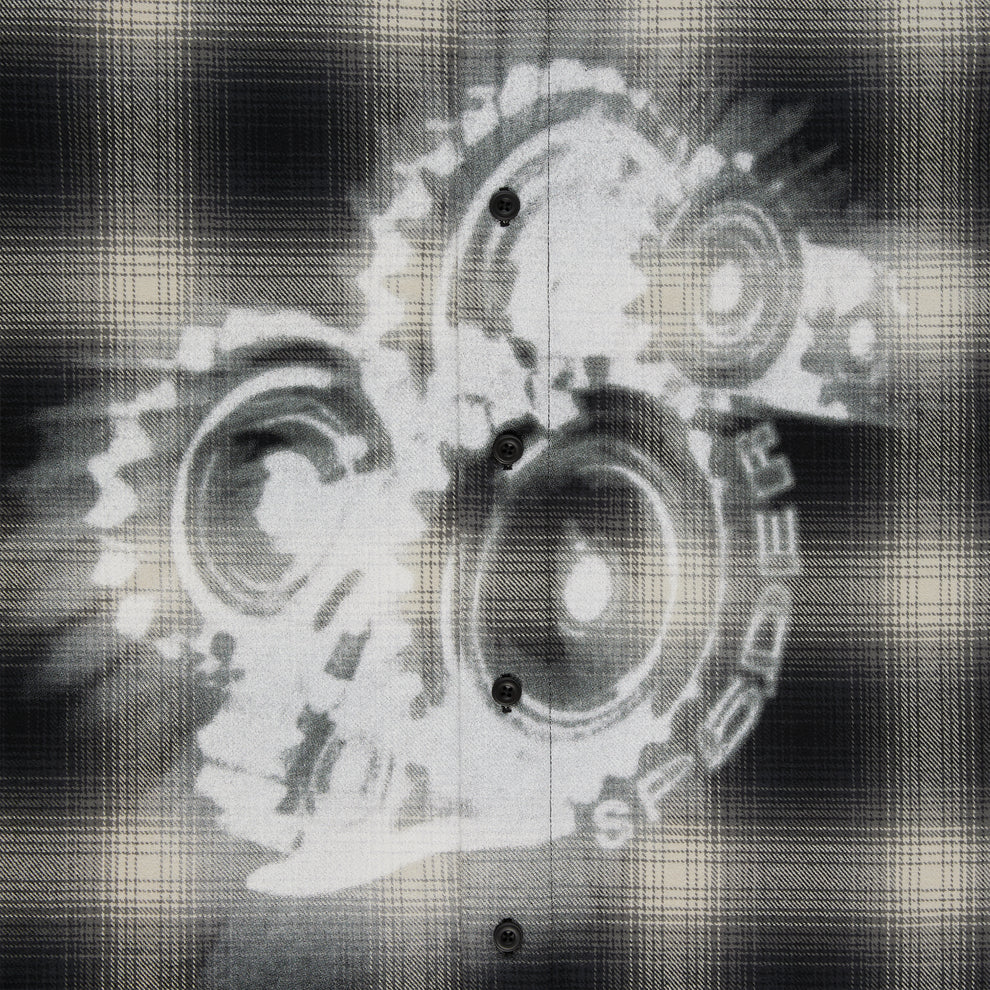 Black and beige plaid cotton flannel shirt with faded white graphic print of gears.