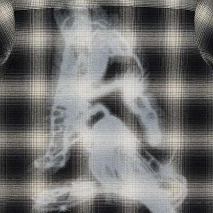 Black and cream plaid cotton flannel shirt with a faded graphic print on the back.