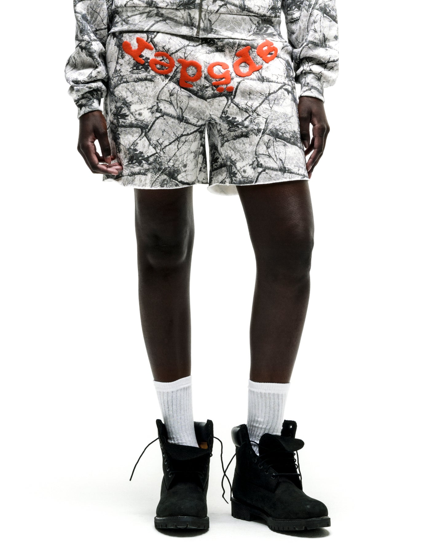 REALTREE OG WEB V2 SWEATSHORT: White camo cotton fleece shorts with orange "OG" text, drawcord, and raw hem.