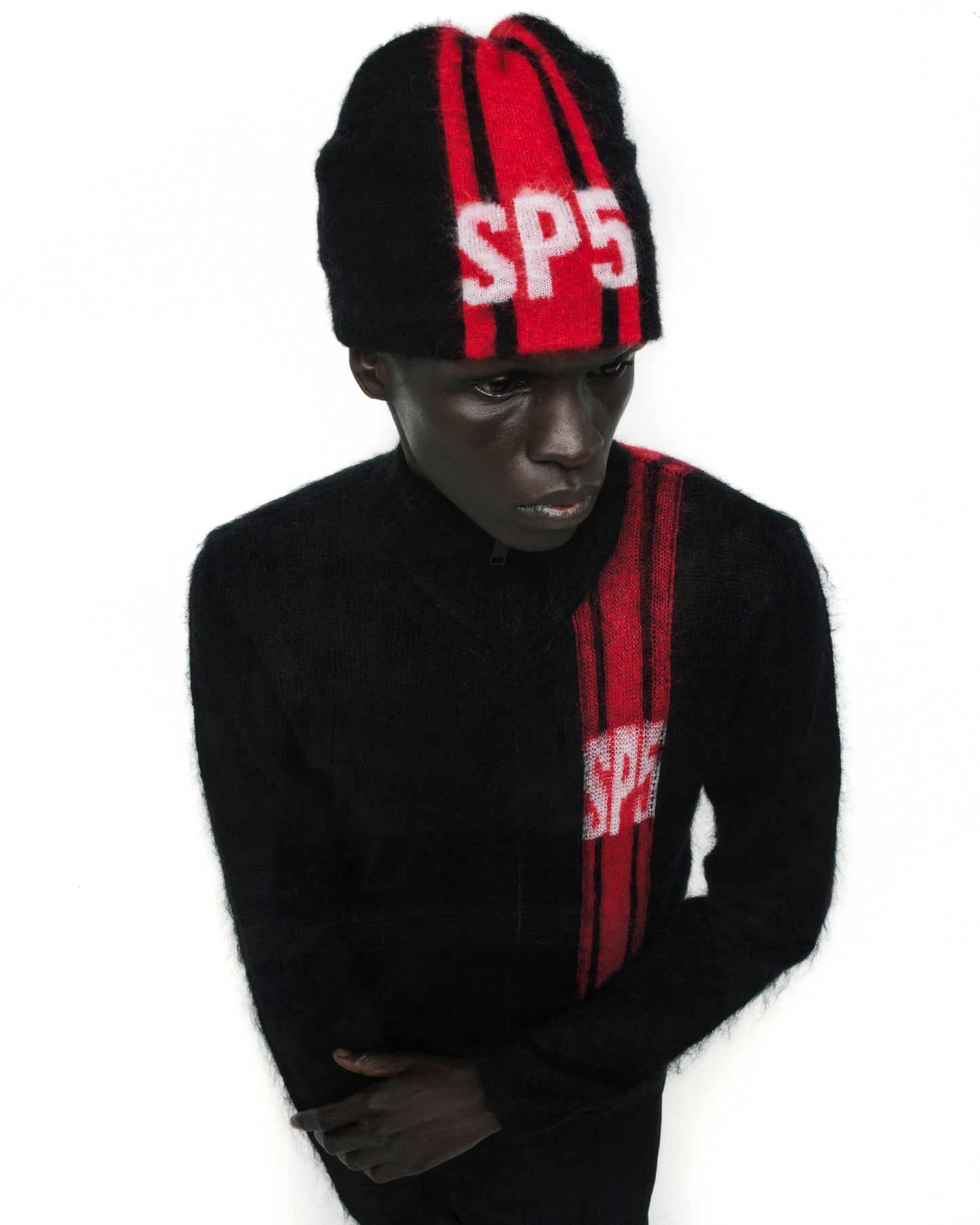 Black mohair knit RALLY BEANIE with red vertical stripes and white "SP5" logo.
