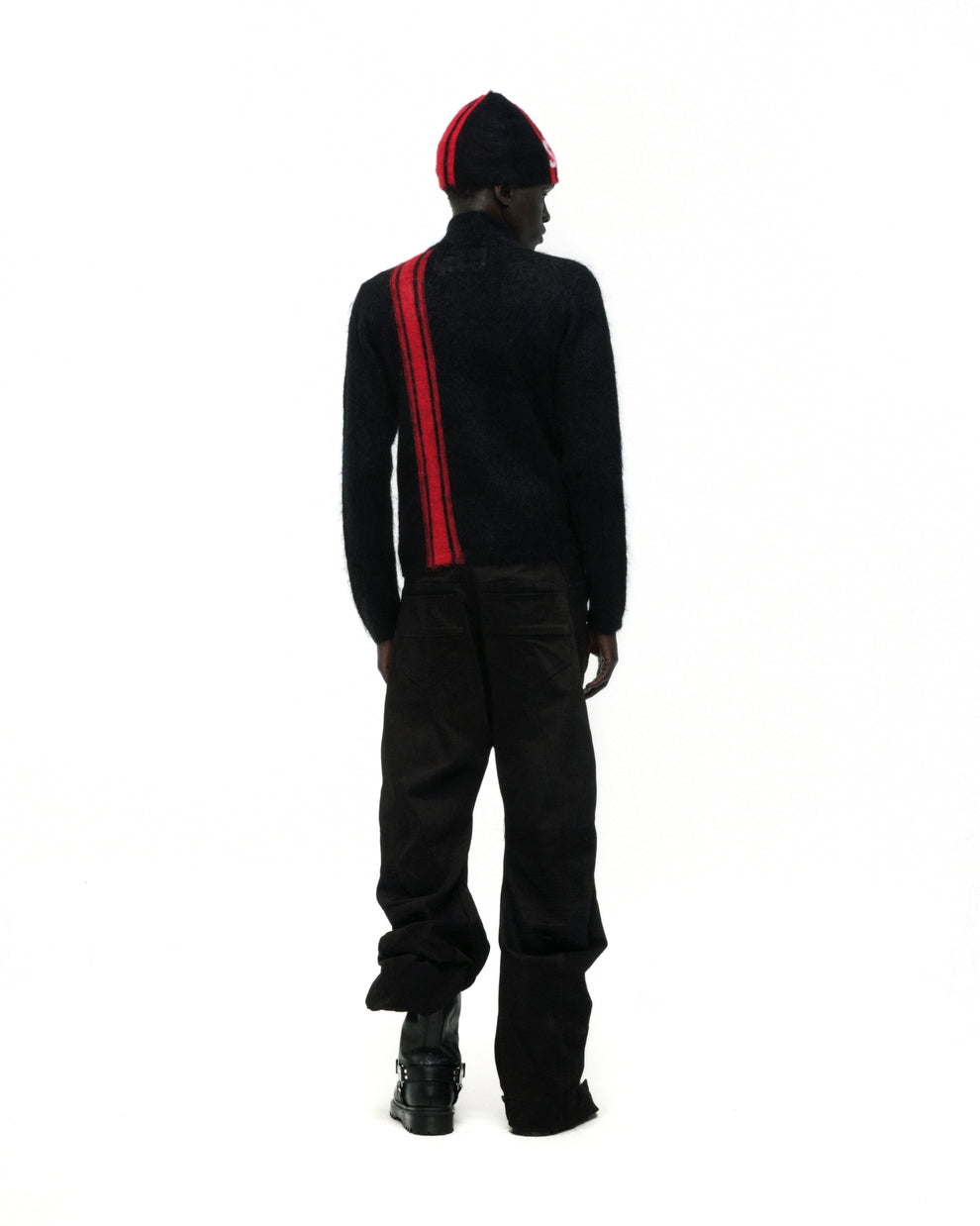 Black mohair knit zip sweater with a red vertical stripe, worn with a matching beanie.